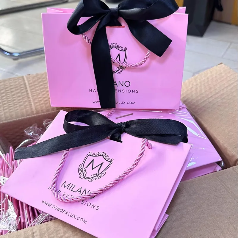 Custom luxury paper bag with foil stamping embossing and rope handles for retail packaging