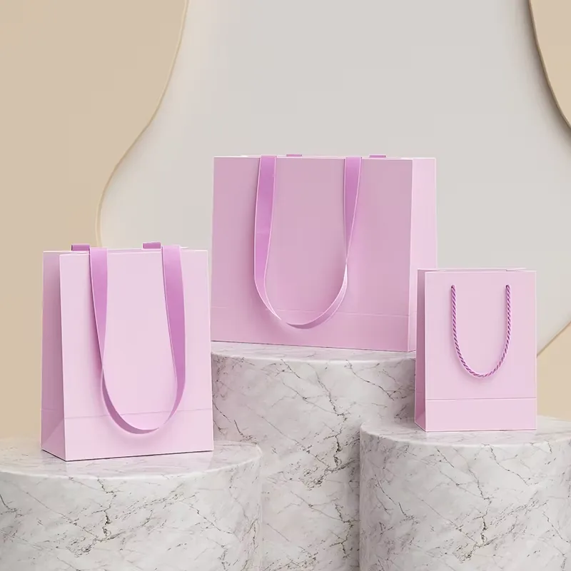 Custom printed paper shopping bag with logo, rope handles and foil stamped finish