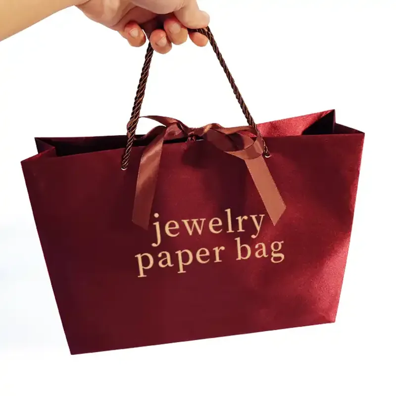 Custom paper bag handles with rope handle structure for luxury retail packaging